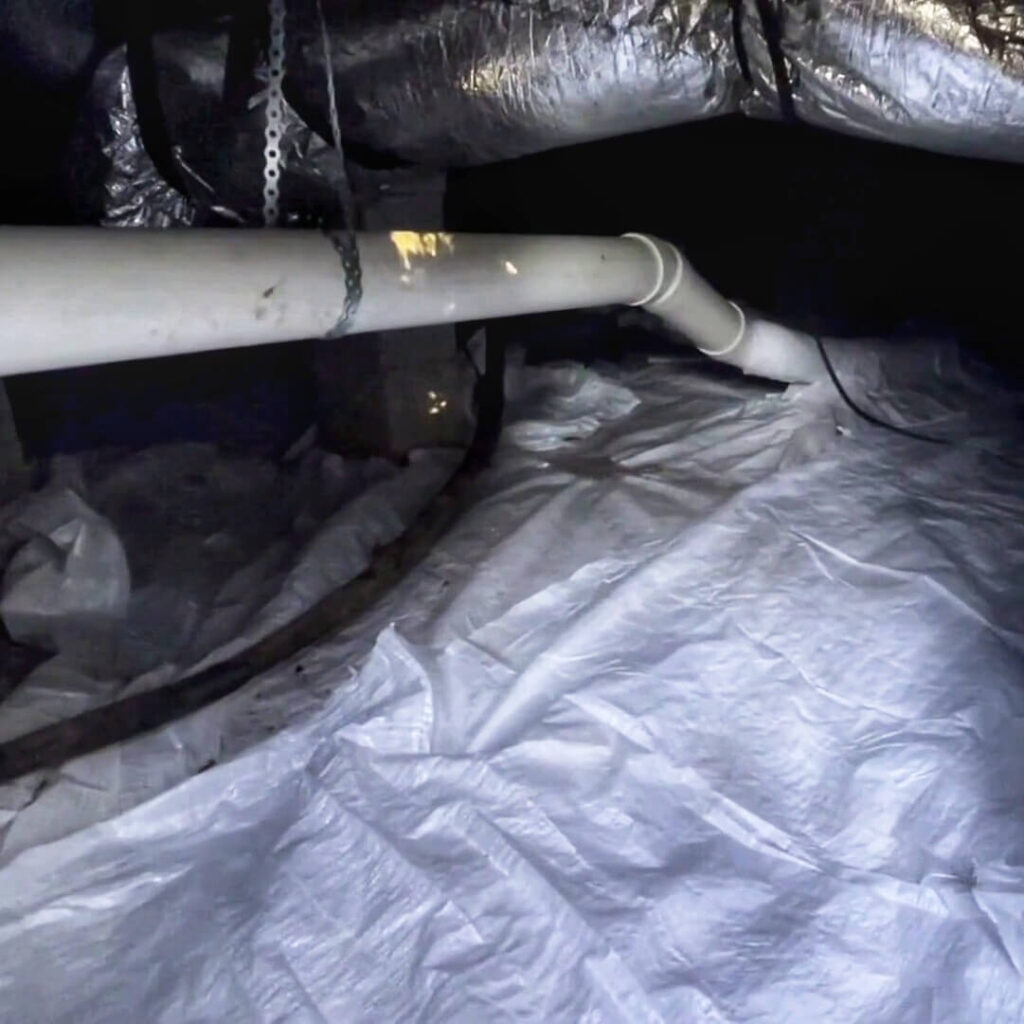 A radon mitigation system that has been installed in a crawl space