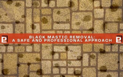 A vinyl floor with black spots representing the potential for asbestos-containing black mastic.