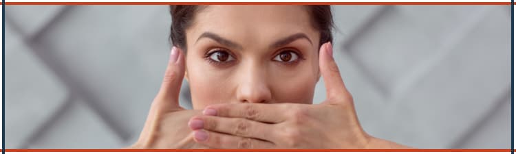 A woman covering her mouth symbolizes the danger of breathing radon gas.