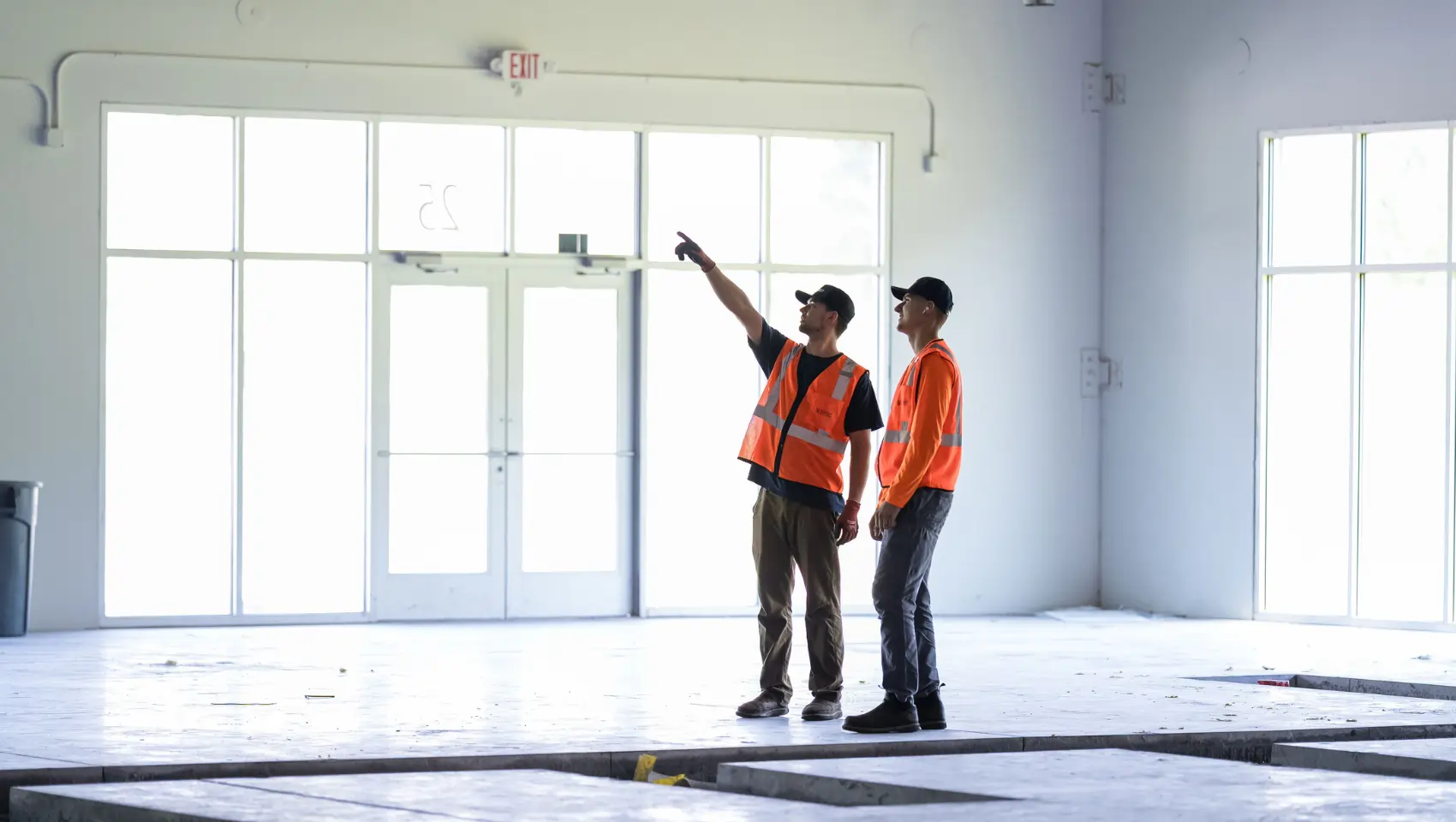 Environmental remediation crew reviewing a commercial space before work begins